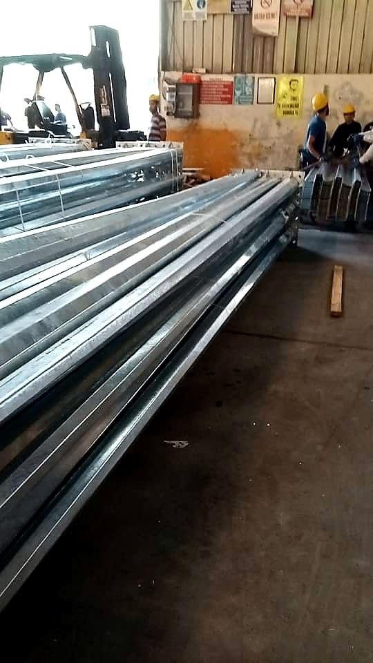 Galvanized poles in warehouse